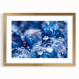 Extra large abstract art print featuring textured swirls in blue and grey tones, framed in gold, ideal for living room decor.