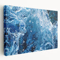 Close-up image of water ripples on a stretched canvas, featuring blue and gray tones, ideal for kitchen wall art.