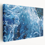 Close-up image of water ripples on a stretched canvas, featuring blue and gray tones, ideal for kitchen wall art.