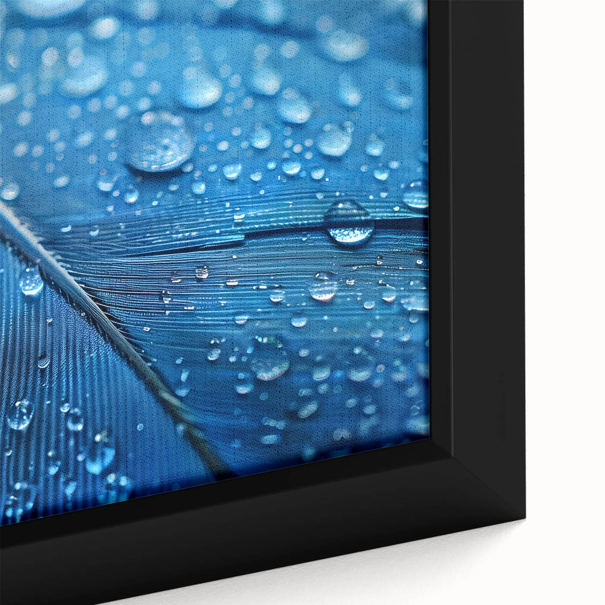Close-up of black wall art featuring colorful, textured water design on a framed canvas, ideal for living room decor.