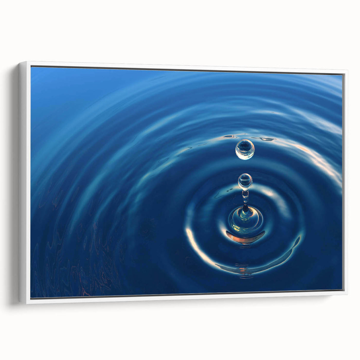 Framed canvas featuring a vintage poster art of vibrant water motifs in blue and green, ideal for living room decor.