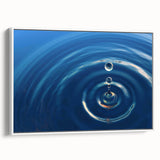 Framed canvas featuring a vintage poster art of vibrant water motifs in blue and green, ideal for living room decor.