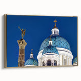 Framed canvas featuring a vintage poster art of a cathedral in muted gold and black tones.
