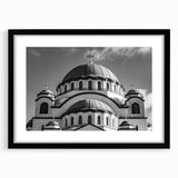 Extra large abstract art print of a colorful, textured cathedral design on a black framed canvas.