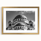 Textured abstract art print of a cathedral, in muted gold and beige tones on a framed canvas, suitable for bedroom decor.