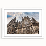 Extra large abstract art print of a cathedral, featuring textured design in muted earth tones, framed with a white mat.