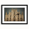 Abstract art print featuring a colorful, textured depiction of a cathedral, presented in a large black frame with mat.