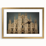 Textured abstract art print of a cathedral design in muted gold and beige tones, framed with a mat.