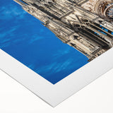 Art deco poster featuring a cathedral design in muted gold and blue tones on rolled canvas.