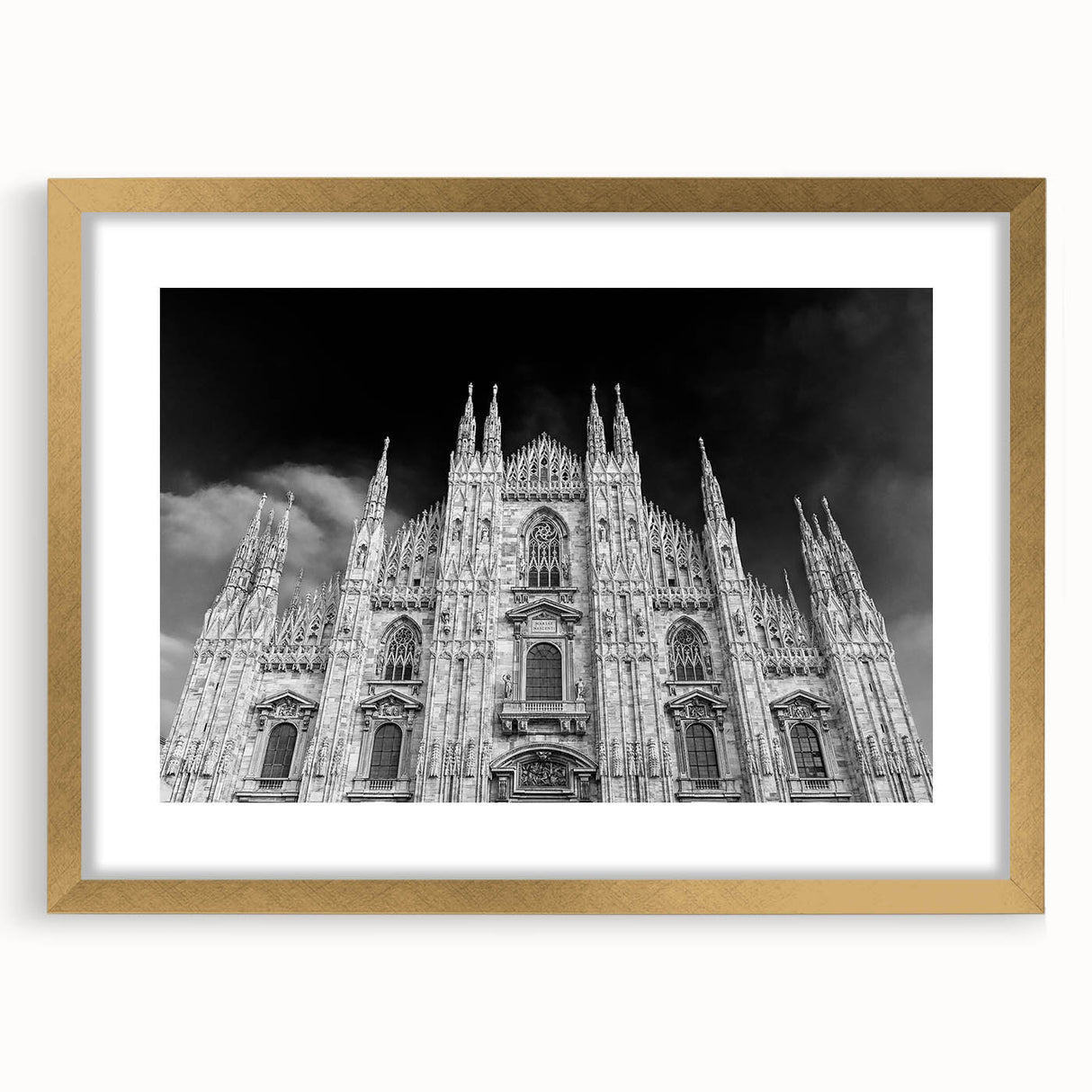 Textured abstract art print of a cathedral, in muted gold and beige tones, framed with a gold mat.