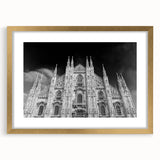 Textured abstract art print of a cathedral, in muted gold and beige tones, framed with a gold mat.