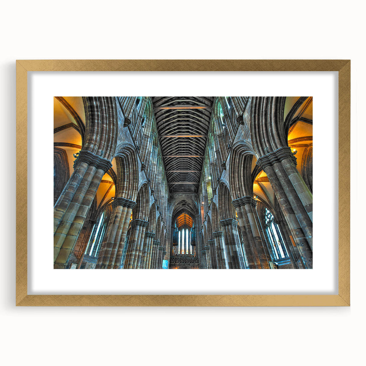 Textured abstract art print of an indistinct church design in muted gold and white, framed with a gold mat.