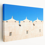 Mosque silhouette in muted gold and blue tones on a stretched canvas, ideal for kitchen wall art.