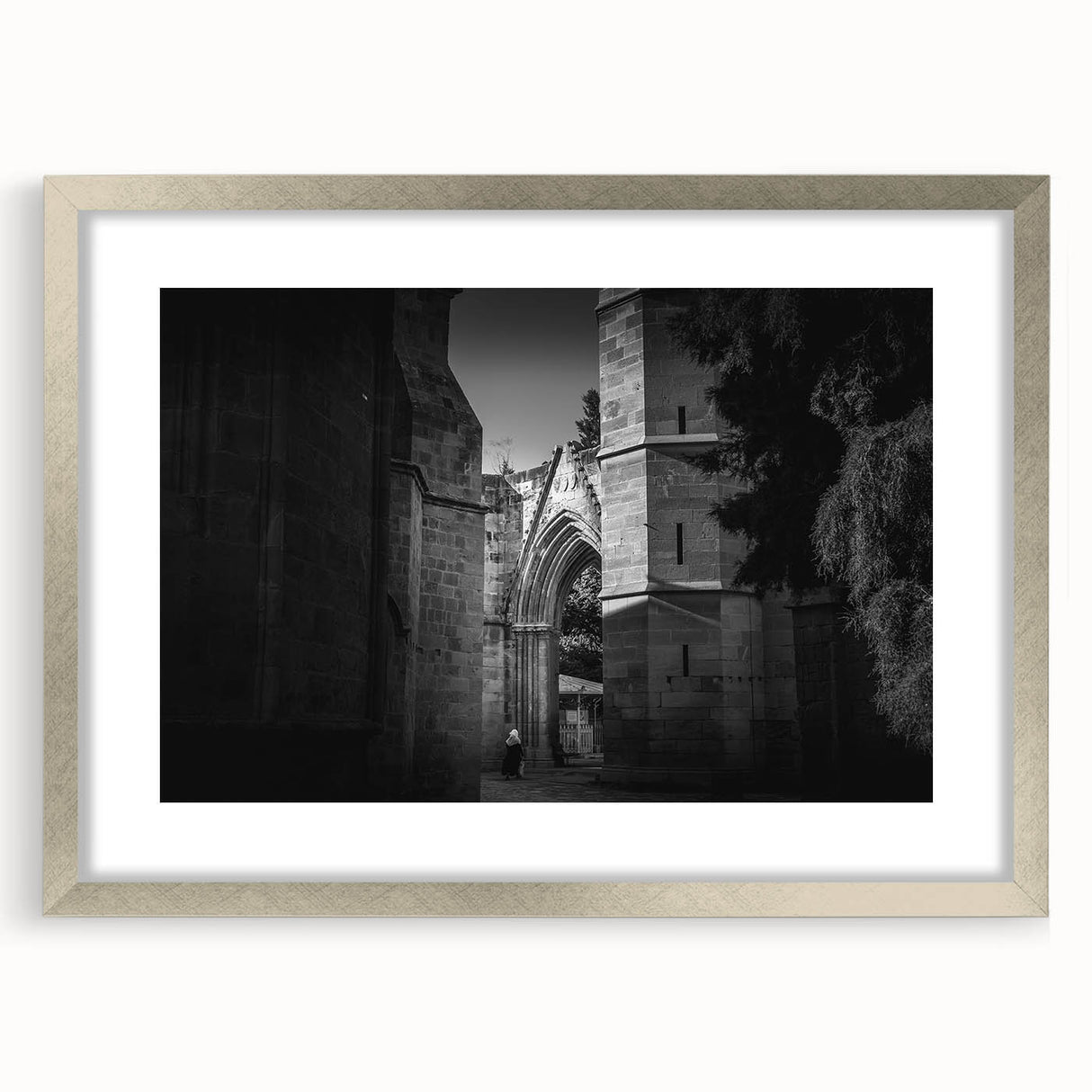 Abstract art print of a stylized mosque in silver and gray tones on a framed canvas.