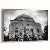 Framed canvas of a vintage poster featuring a mosque design, with a palette of black and vibrant colors.