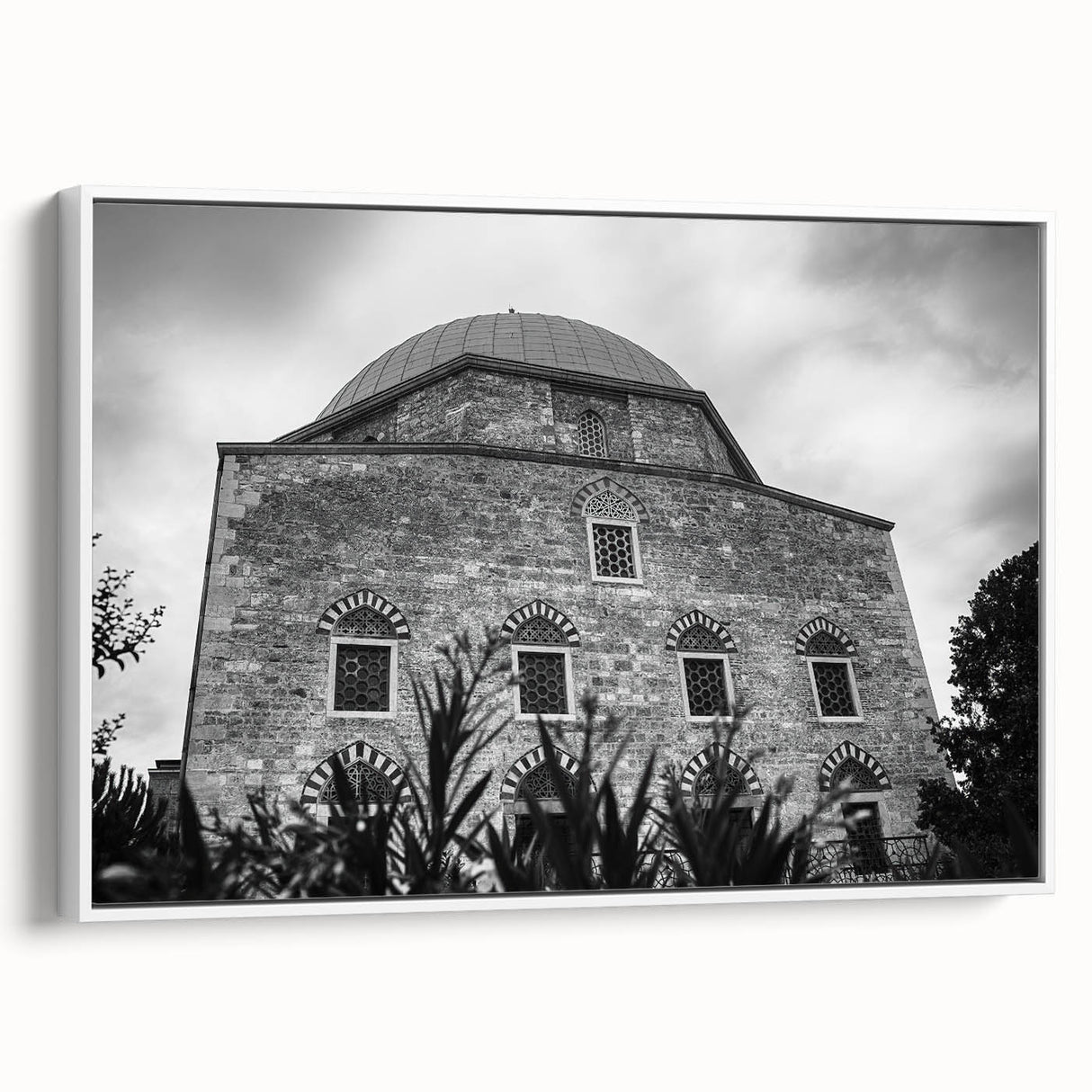 Framed canvas featuring a black and white vintage poster of a mosque landscape, ideal for bedroom wall art.