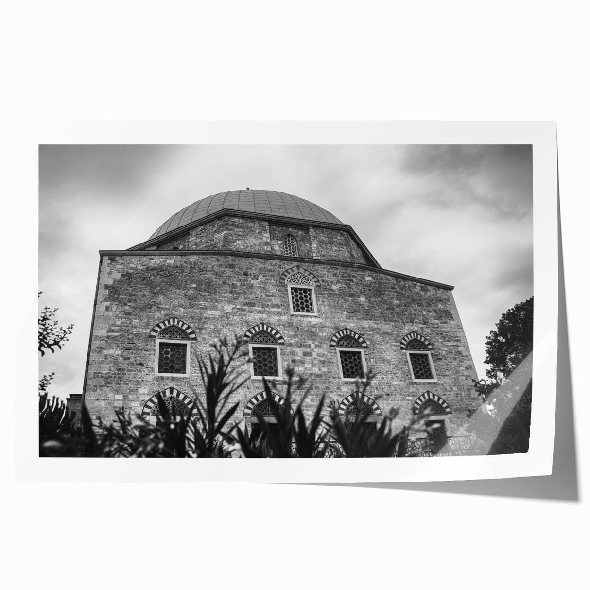 Extra large rolled print depicting a mosque with intricate floral designs in muted earth tones.