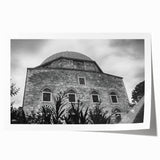 Extra large rolled print depicting a mosque with intricate floral designs in muted earth tones.