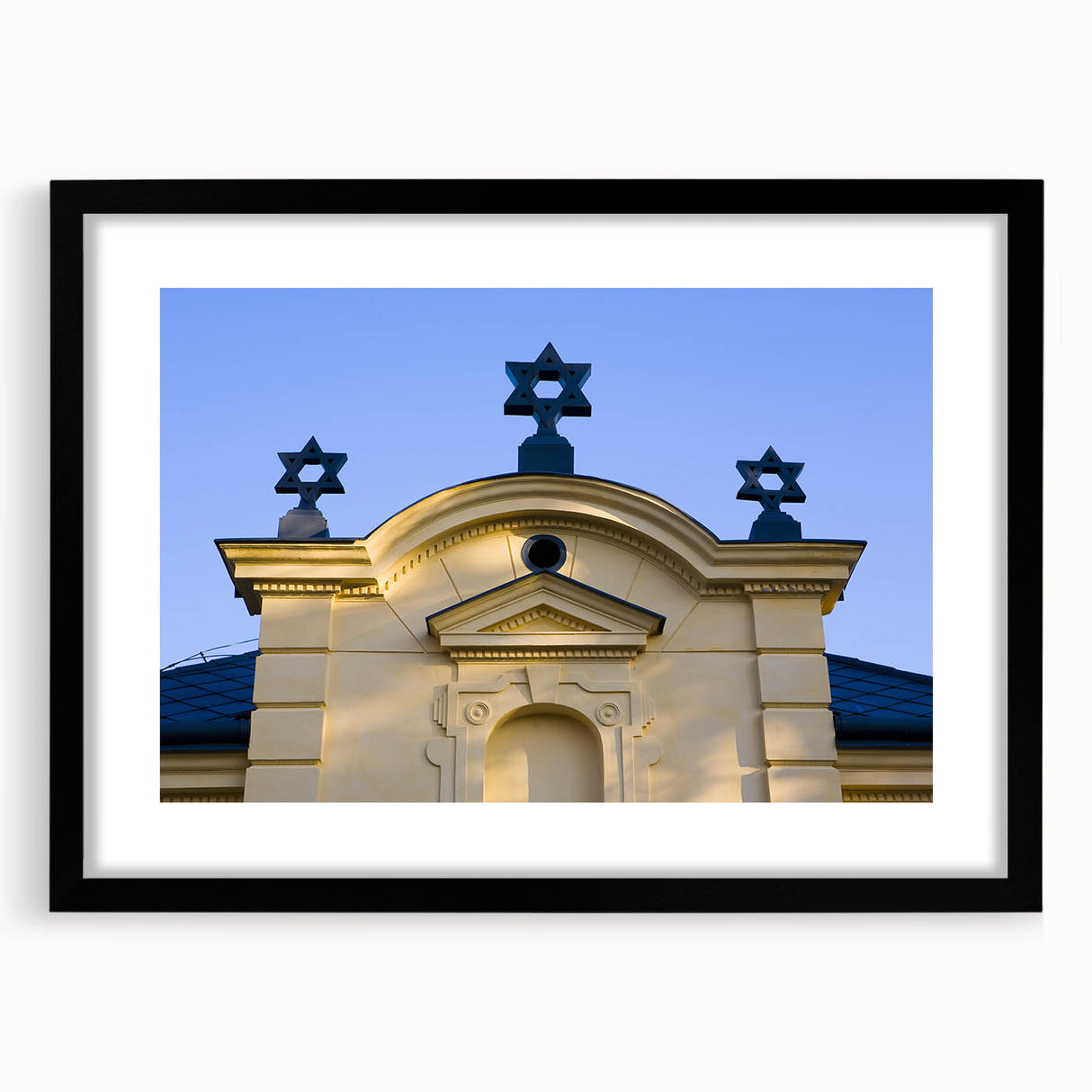 Abstract art print featuring a colorful, textured depiction of a synagogue, set in a black frame with mat.