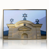 Mid-century modernist art of a synagogue in muted gold tones on framed acrylic, suitable for nursery wall decor.