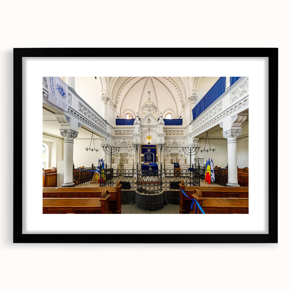 Abstract art print of a colorful synagogue design in vibrant hues on a large framed canvas, suitable for living room decor.