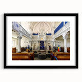 Abstract art print of a colorful synagogue design in vibrant hues on a large framed canvas, suitable for living room decor.