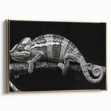 Framed canvas wall art showcasing a vibrant chameleon design with gold accents, set against a dark background, perfect for enhancing modern decor.