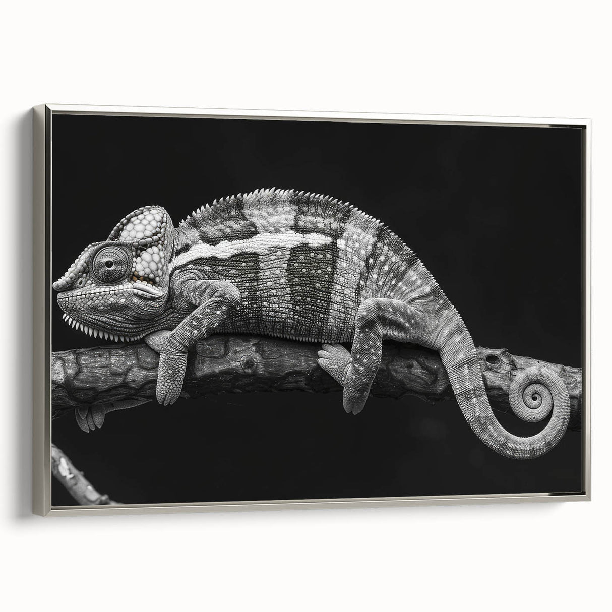 Framed wall art showcasing a vibrant chameleon design on textured canvas, featuring a silver frame, ideal for reptile enthusiasts and home decor.