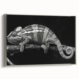 Framed wall art showcasing a vibrant chameleon design on textured canvas, featuring a silver frame, ideal for reptile enthusiasts and home decor.