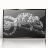 Framed wall art featuring a vibrant chameleon design, showcasing intricate colors and details, set in a sleek silver frame for modern decor.
