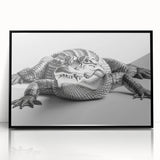 Framed wall art featuring a vibrant reptile design showcasing alligators and crocodiles, set in a sleek black frame, perfect for wildlife enthusiasts and home decor.