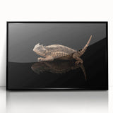 Framed wall art featuring a vibrant lizard design, showcasing intricate details in bold colors with a sleek black frame, perfect for reptile enthusiasts' decor.