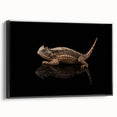 Framed wall art showcasing a vibrant reptile and lizard design on canvas, featuring a sleek black frame, perfect for adding a unique touch to modern decor.