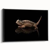Framed wall art showcasing a vibrant reptile and lizard design on canvas, featuring a sleek black frame, perfect for adding a unique touch to modern decor.