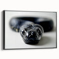 Framed wall art featuring a striking snake design on a textured canvas, showcasing vibrant colors against a sleek black background, perfect for reptile enthusiasts.