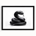 Framed wall art featuring a striking reptile and snake design with a black matte finish, perfect for enhancing modern decor in living spaces.
