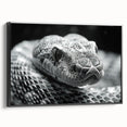 Framed canvas wall art showcasing a striking snake design with intricate patterns, featuring a black frame and side view perspective, perfect for reptile enthusiasts.