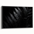 Black-framed canvas wall art showcasing a vibrant abstract design, angled to highlight its depth and texture, perfect for modern home decor accents.
