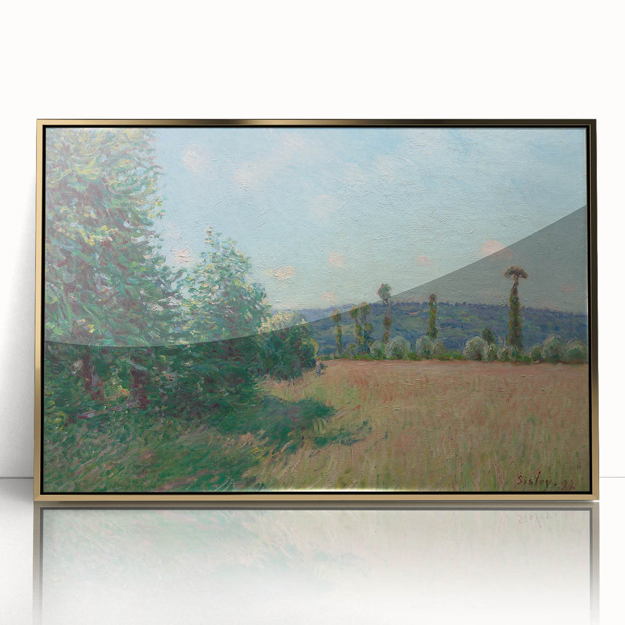 Large art print of an Alfred Sisley landscape in muted greens and blues, framed in gold acrylic.
