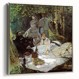 Framed canvas of Claude Monet's landscape painting, featuring vibrant green and blue tones, ideal for living room decor.