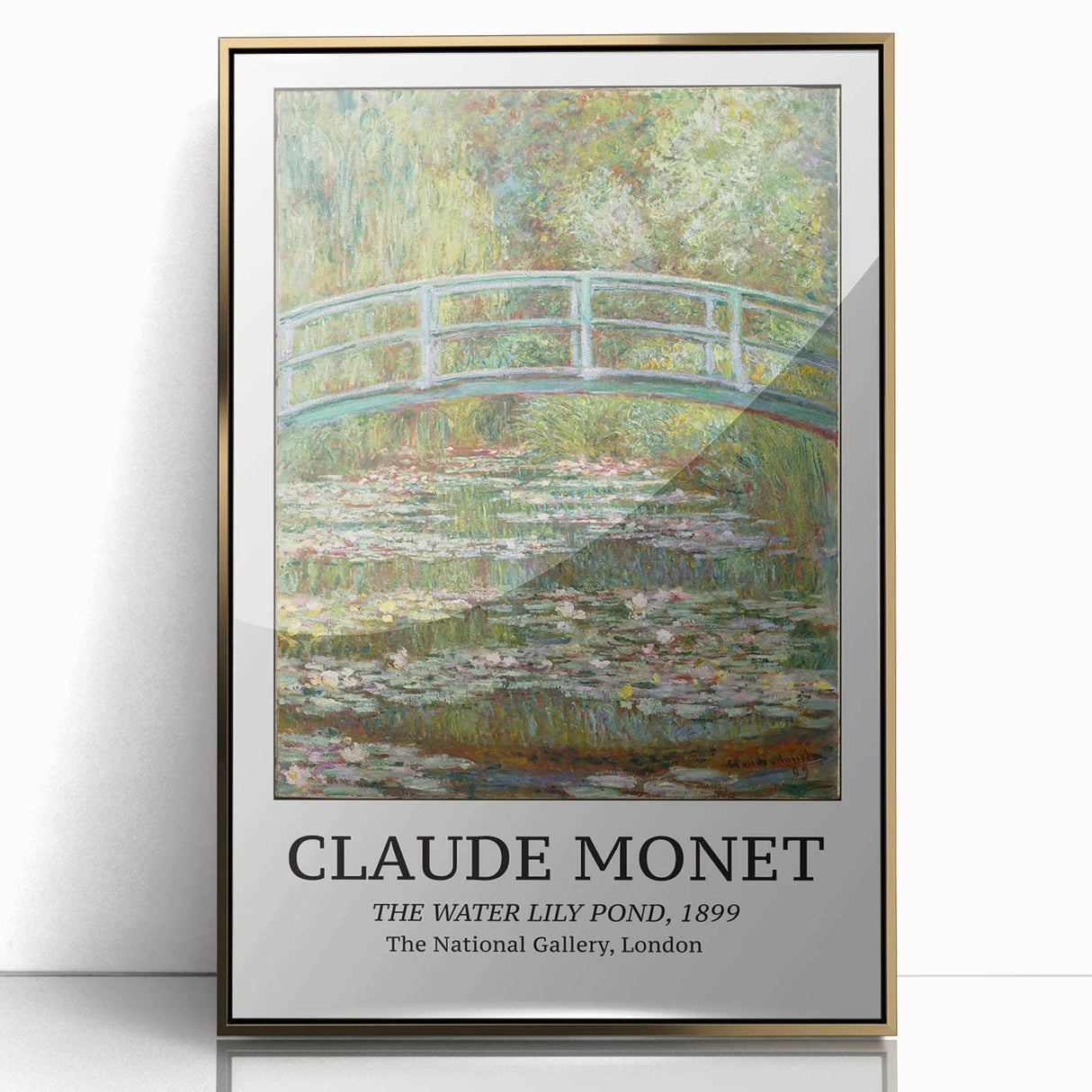 Large art print of a Claude Monet painting in a gold frame, featuring soft pastel colors.