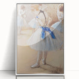 Acrylic print of Edgar Degas' artwork featuring ballet dancers, in muted pastel shades, framed in white.
