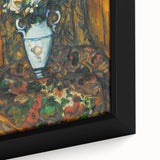 Close-up of a black framed canvas featuring a textured, colorful abstract painting.