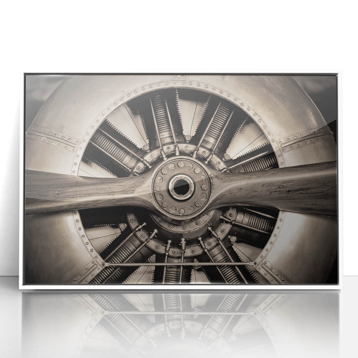 Mid-century modernist art depicting a sleek airplane in muted gray and blue tones on a framed acrylic.