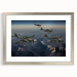 Abstract art print of an airplane in muted gray and blue tones, framed in silver, suitable for bedroom or dining room decor.