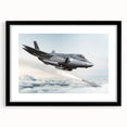 Abstract art print featuring a colorful airplane design on textured canvas, framed in black.