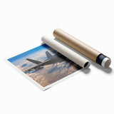 Rolled print of an airplane in flight, depicted in muted gray and blue tones, ideal for modern dining room decor.