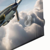 Large abstract wall art of an airplane in flight, rendered in shades of blue and gray on acrylic glass.