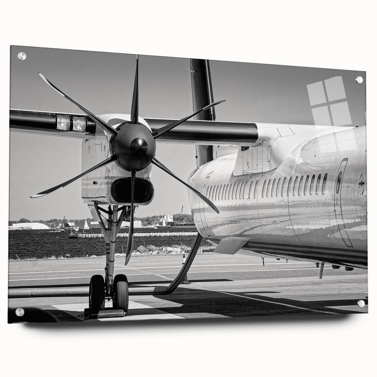 Acrylic print of a side view of an airplane in grayscale, suitable for modern bedroom or dining room decor.