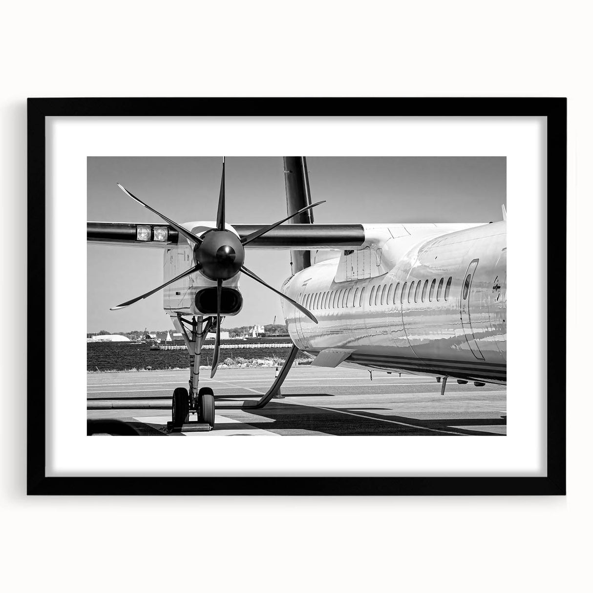 Extra large, colorful abstract art print of an airplane, textured on black framed canvas, ideal for living room decor.